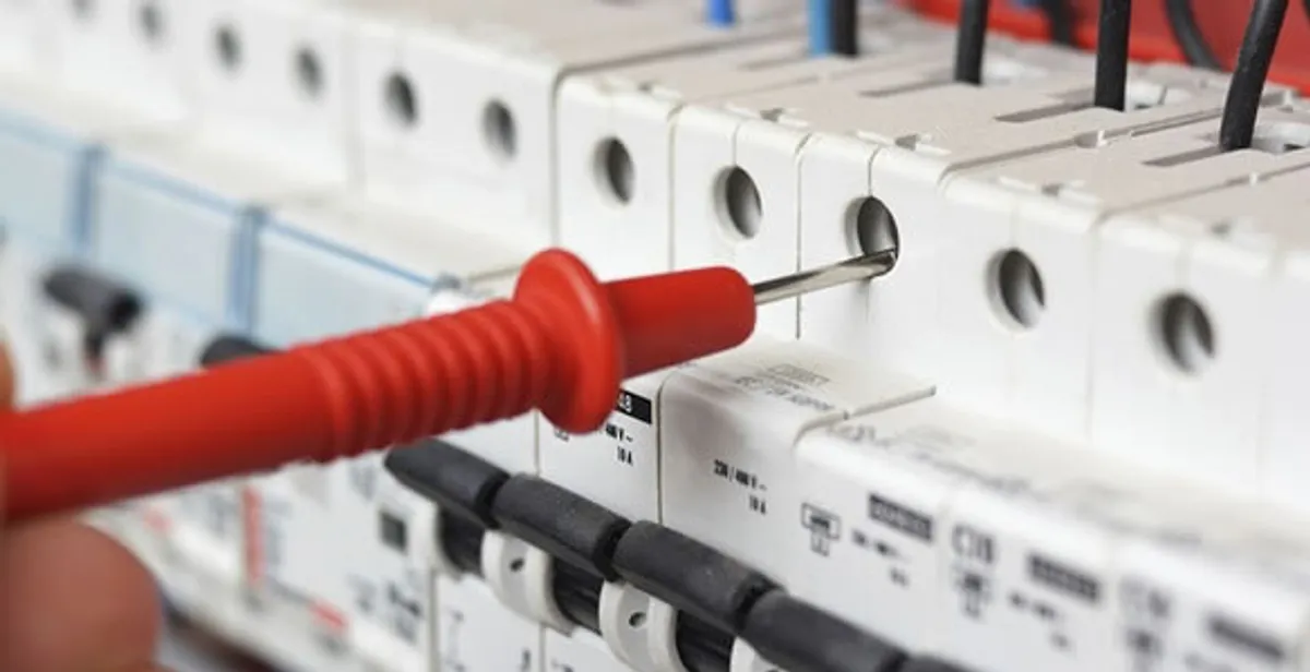 Electrical contractor testing circuit breakers during electrical repair in Harvey, LA