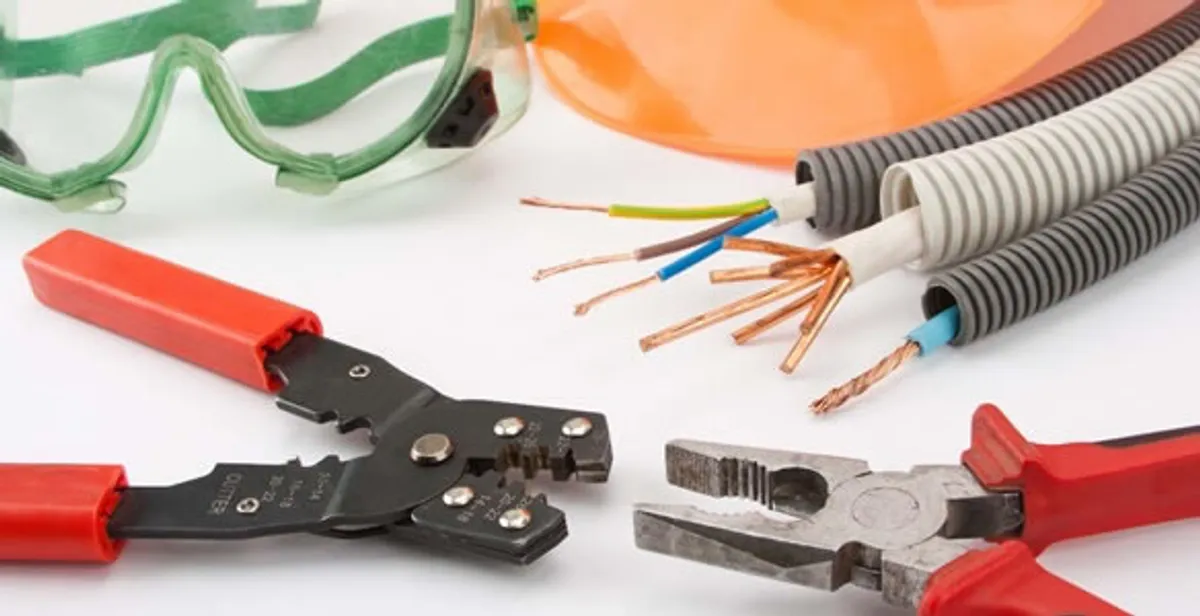 Electrical wiring repair with professional tools and safety equipment in Metairie, LA