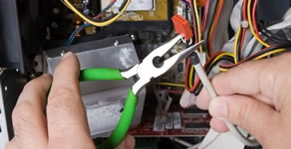 Licensed electrical contractor performing electrical repair with tools in Harvey, LA